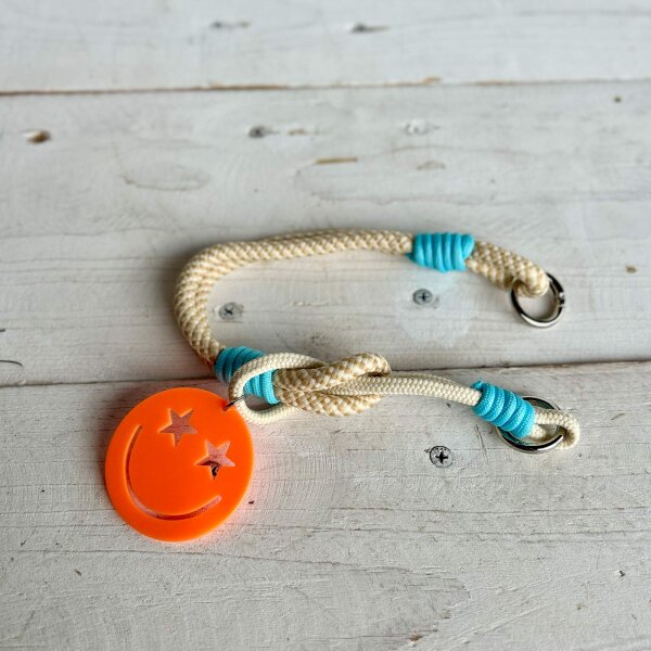 Schlüssel-/Handyband Smiley neonorange